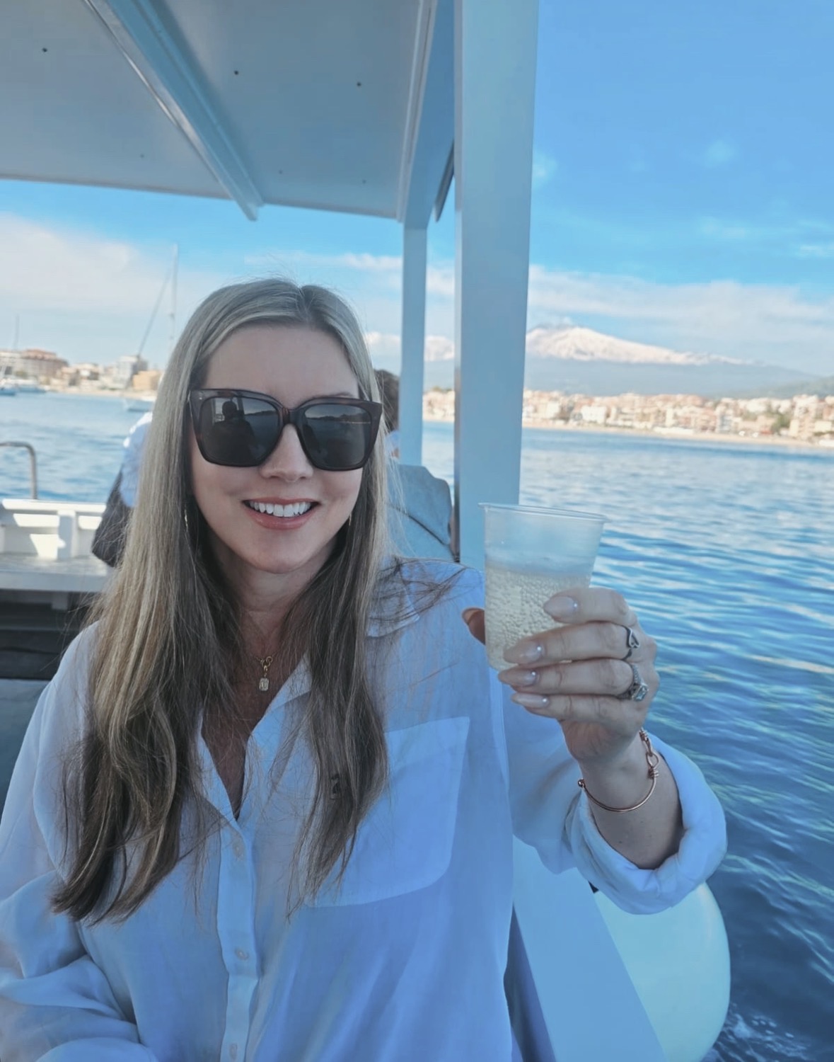 Kiki, founder of Jet & Swim, on a boat off the coast of Sicily