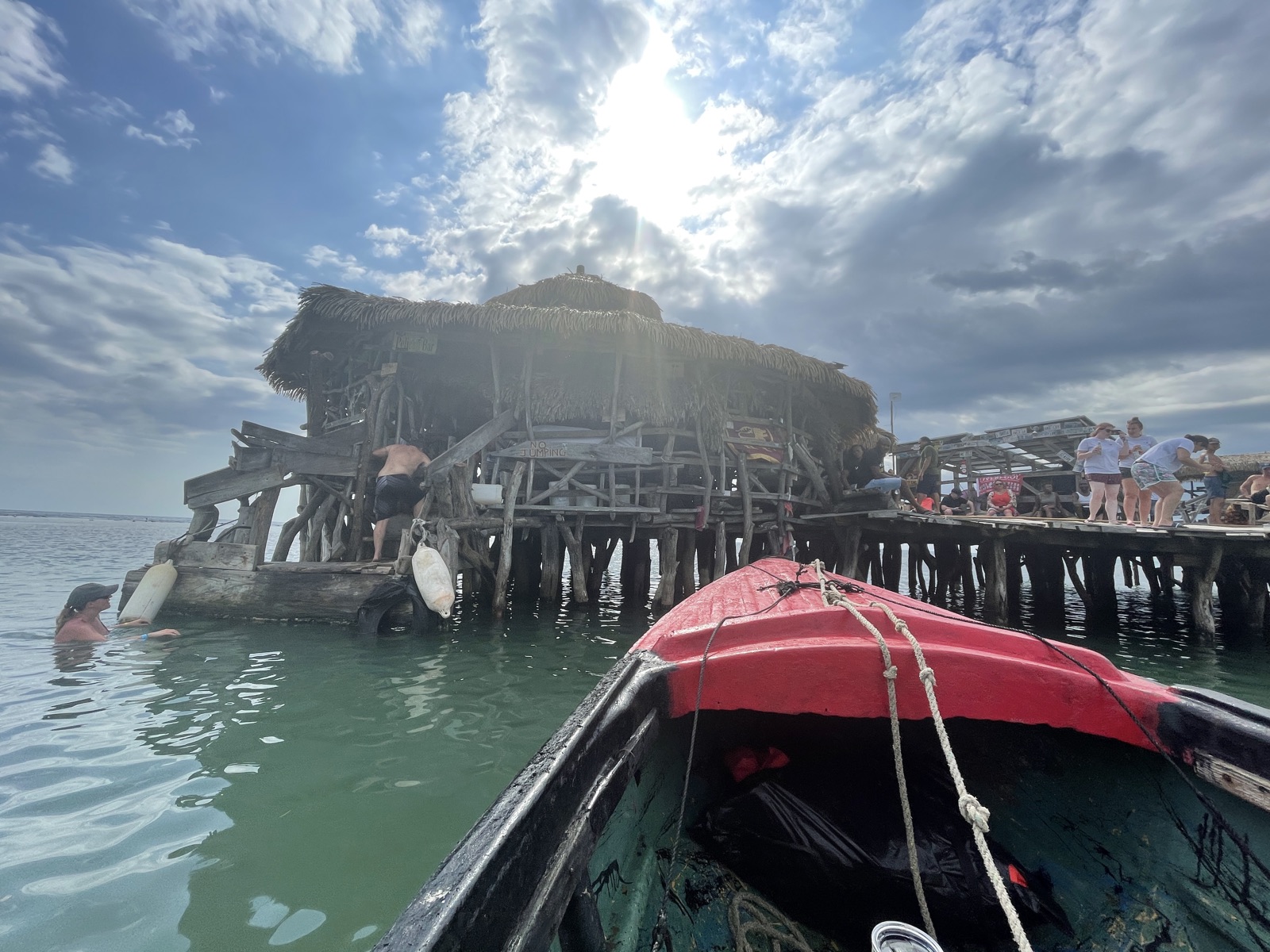 Floyd's Pelican Bar, a thatched driftwood shack standing on wooden stilts on a sandbar in the middle of the sea off Jamaica's south coast
