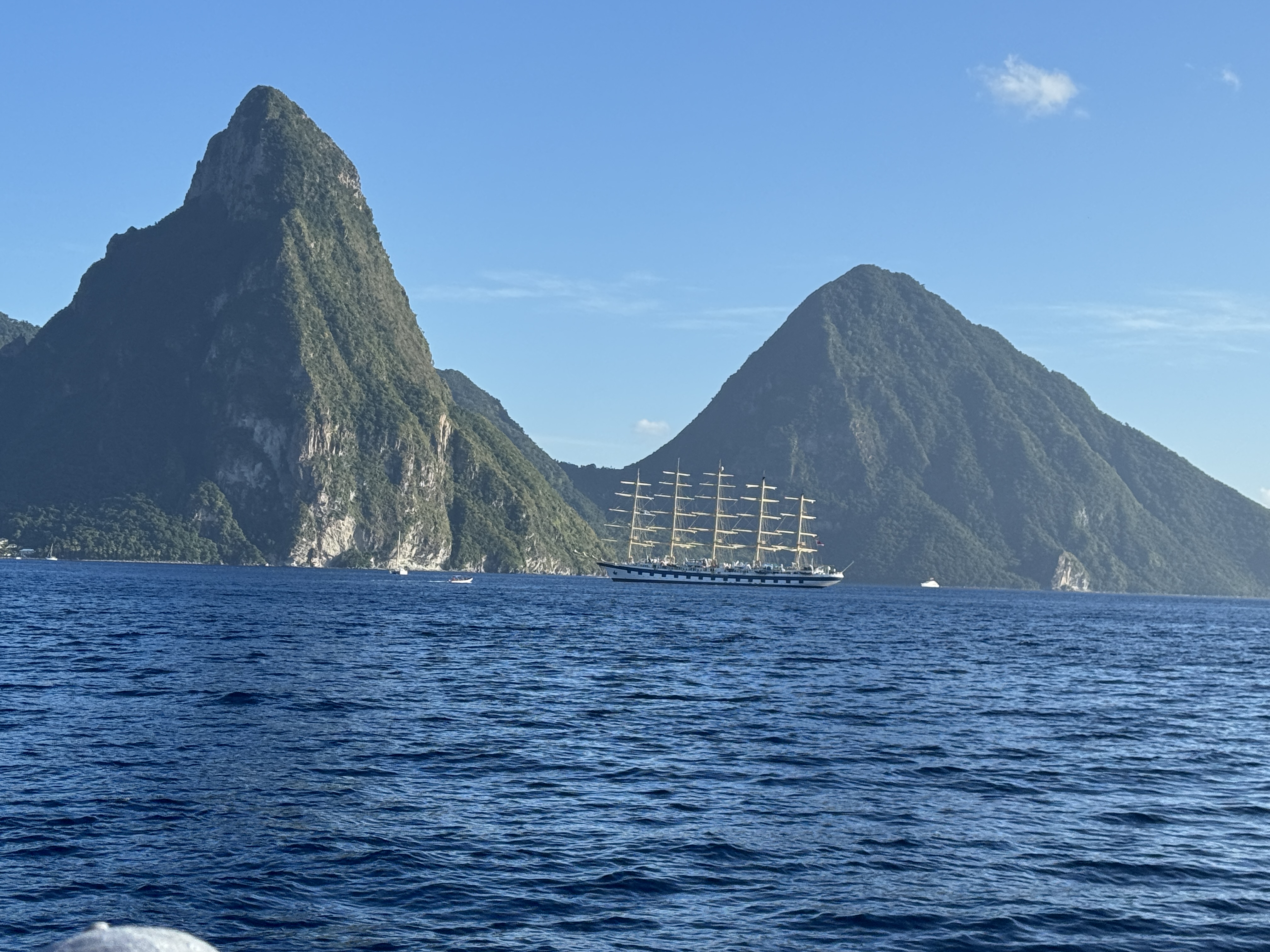 St. Lucia's Pitons with a tall ship passing beneath them