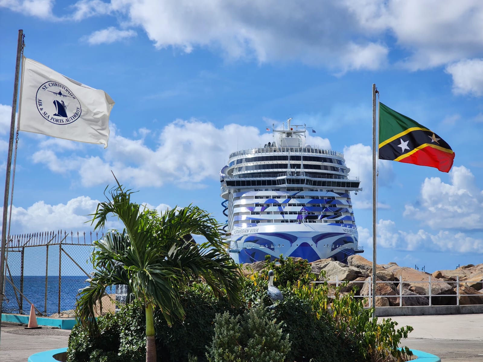 The Norwegian Viva docked at St. Kitts beneath the island's flags