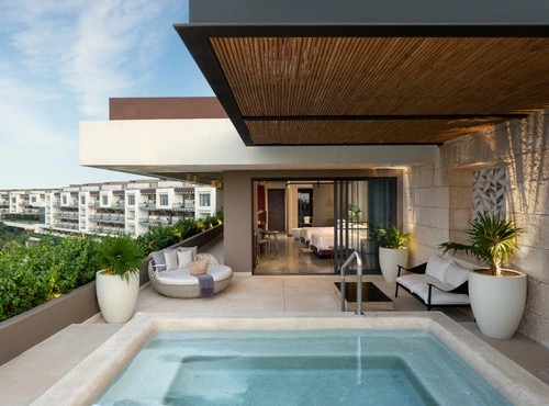 INSPIRA Rooftop Suite at Atelier Playa Mujeres, with a private plunge pool and daybed on the rooftop terrace