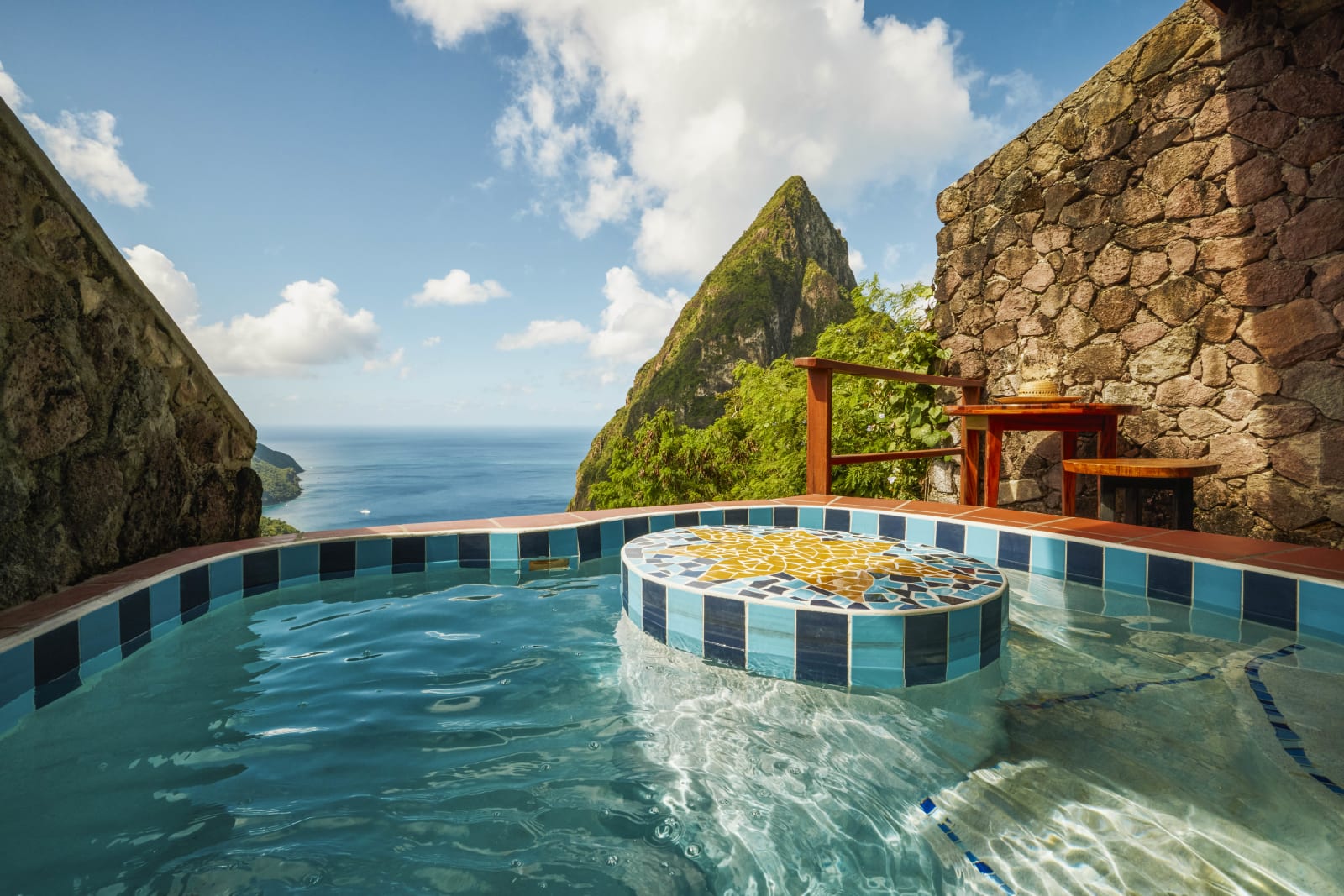 An open-wall suite at Ladera Resort with a private plunge pool facing the Pitons