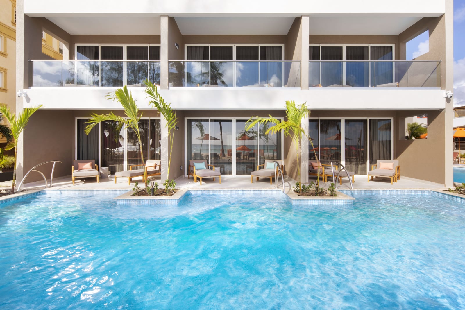 Luxury Swim Up Suite at O2 Beach Club & Spa, with a private patio stepping into the adults-only River Pool