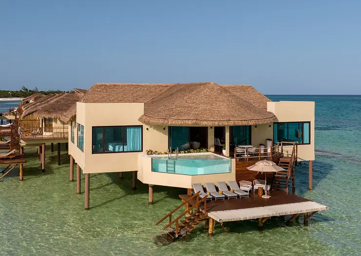 Infinity plunge pool on the private deck of an overwater bungalow at Palafitos, El Dorado Maroma