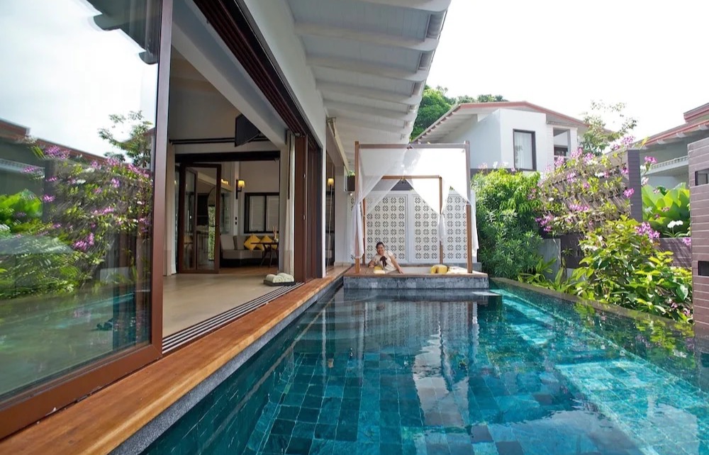 Private pool villa at The Shore at Katathani, terraced into the hillside above Kata Noi Beach
